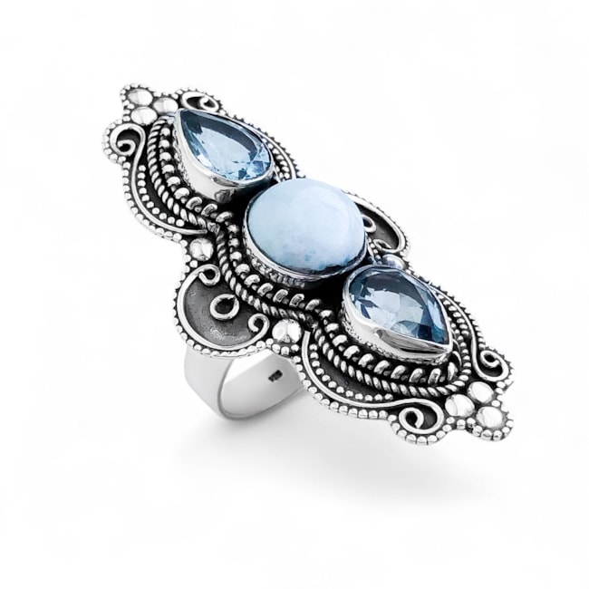 Anel de Pedra Larimar Oval no Meio e Topázio Azul em Gota